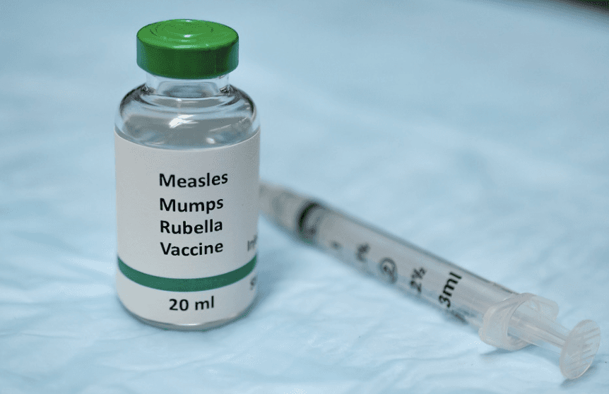 lady in white dress shirt holding white box