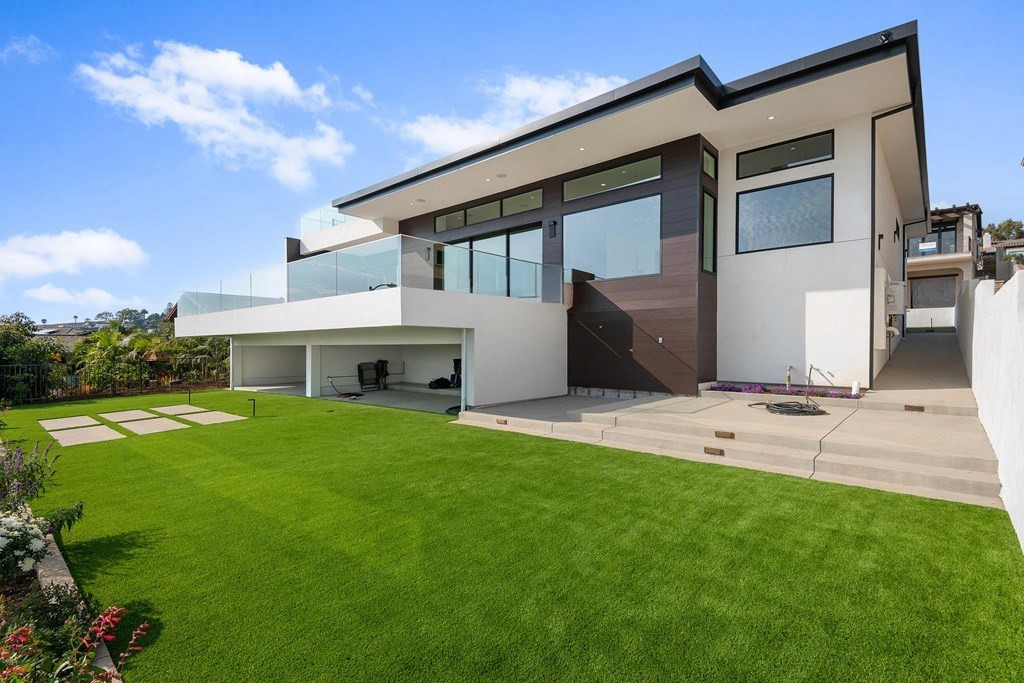 Backyard photo featuring a large patio for outdoor entertaining.