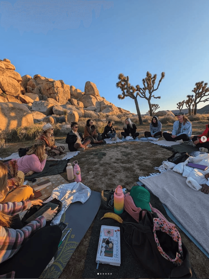 people in a large building with Tate Modern in the background