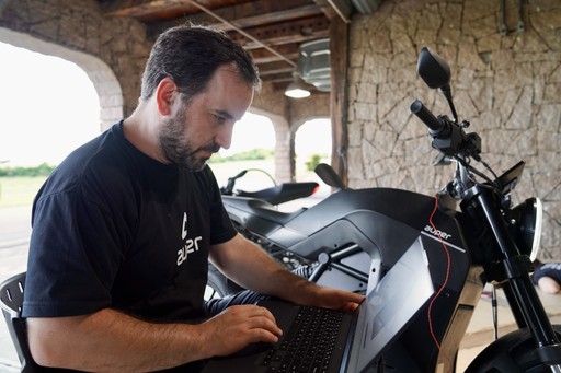 Man, laptop and a bike