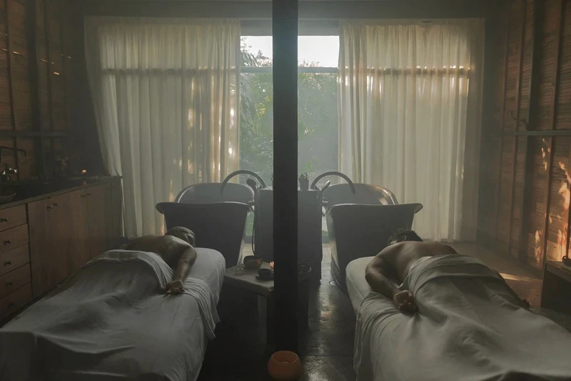 Yäan Spa at Be Tulum: two women relaxing after receiving a massage, with two hot tubs in the background overlooking the jungle.