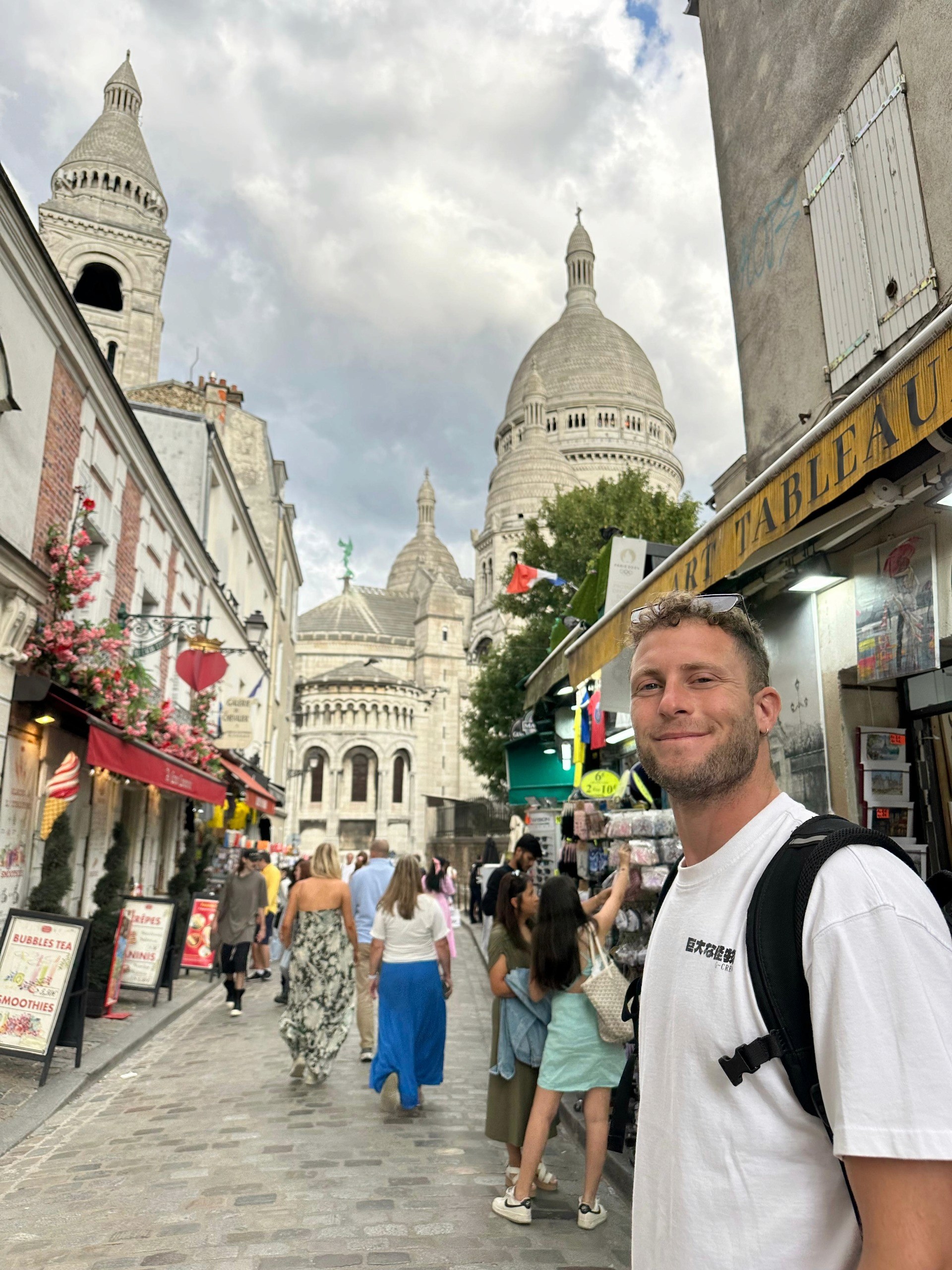 a man in france with a big church in the background