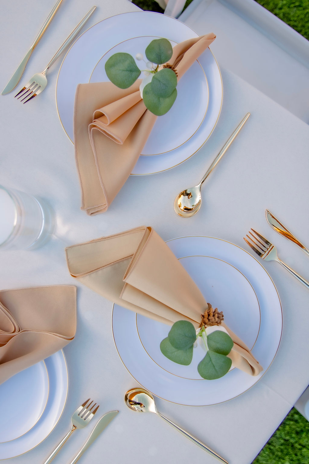 A beautifully decorated wedding cake featuring red and white roses.