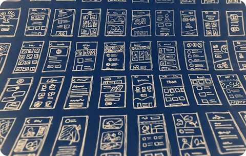 Abstract image of mobile UI wireframes.