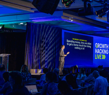 A Man Talking using Microphone in the Conference Room