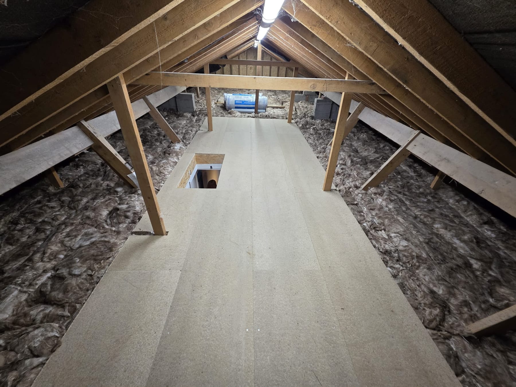 Raised loft boarding, insulation left uncompressed