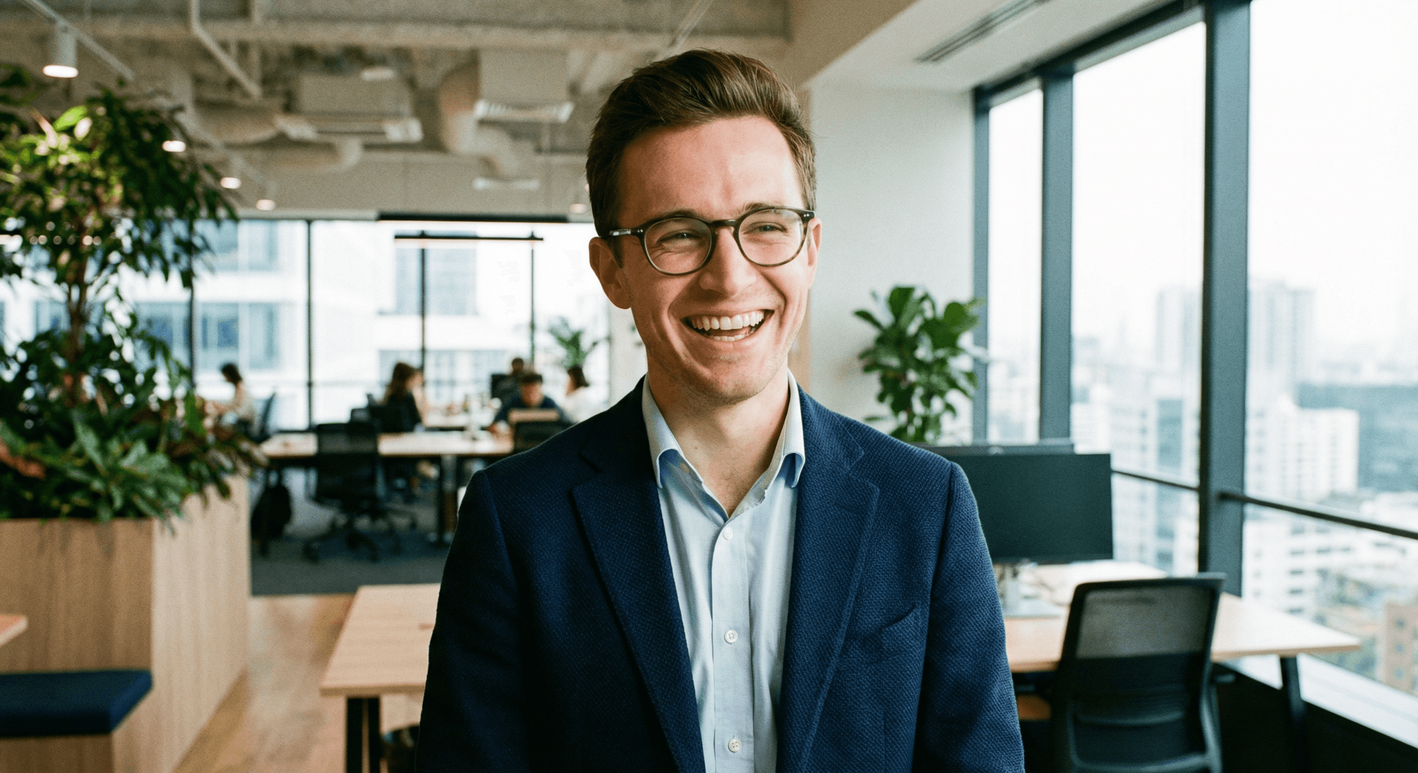 Testimonial card showing a man in glasses smiling in a modern workspace, with feedback praising fast delivery, creative edits, and smooth communication, accompanied by a four-star rating.