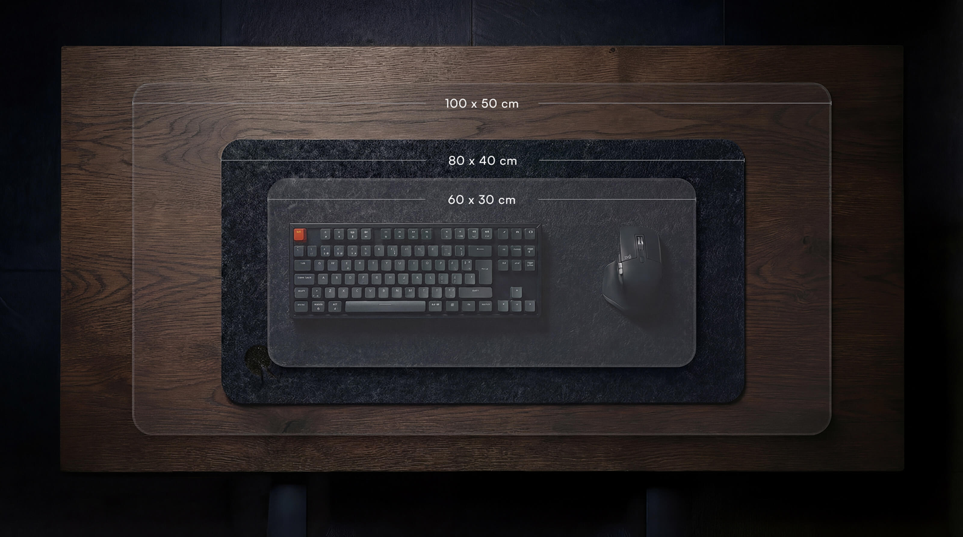 Top-down view of Qilky felt desk mat showing three available sizes for different desk setups