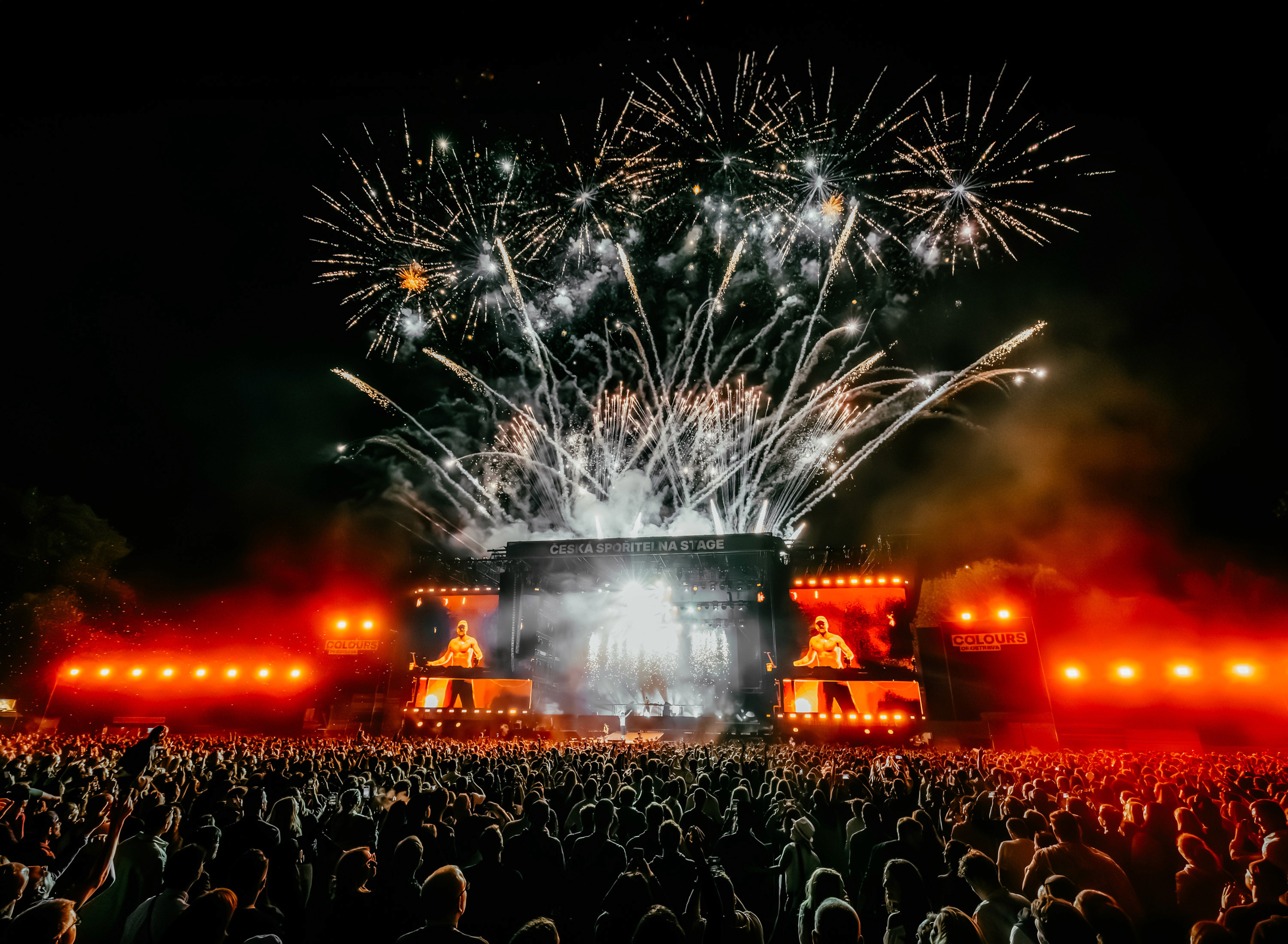 Fireworks lighting up the night sky above a packed concert crowd at Colours of Ostrava.