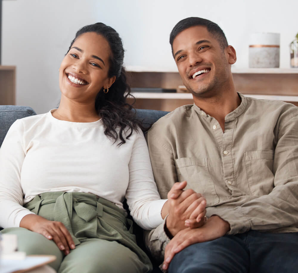 happy couple listening to doctor