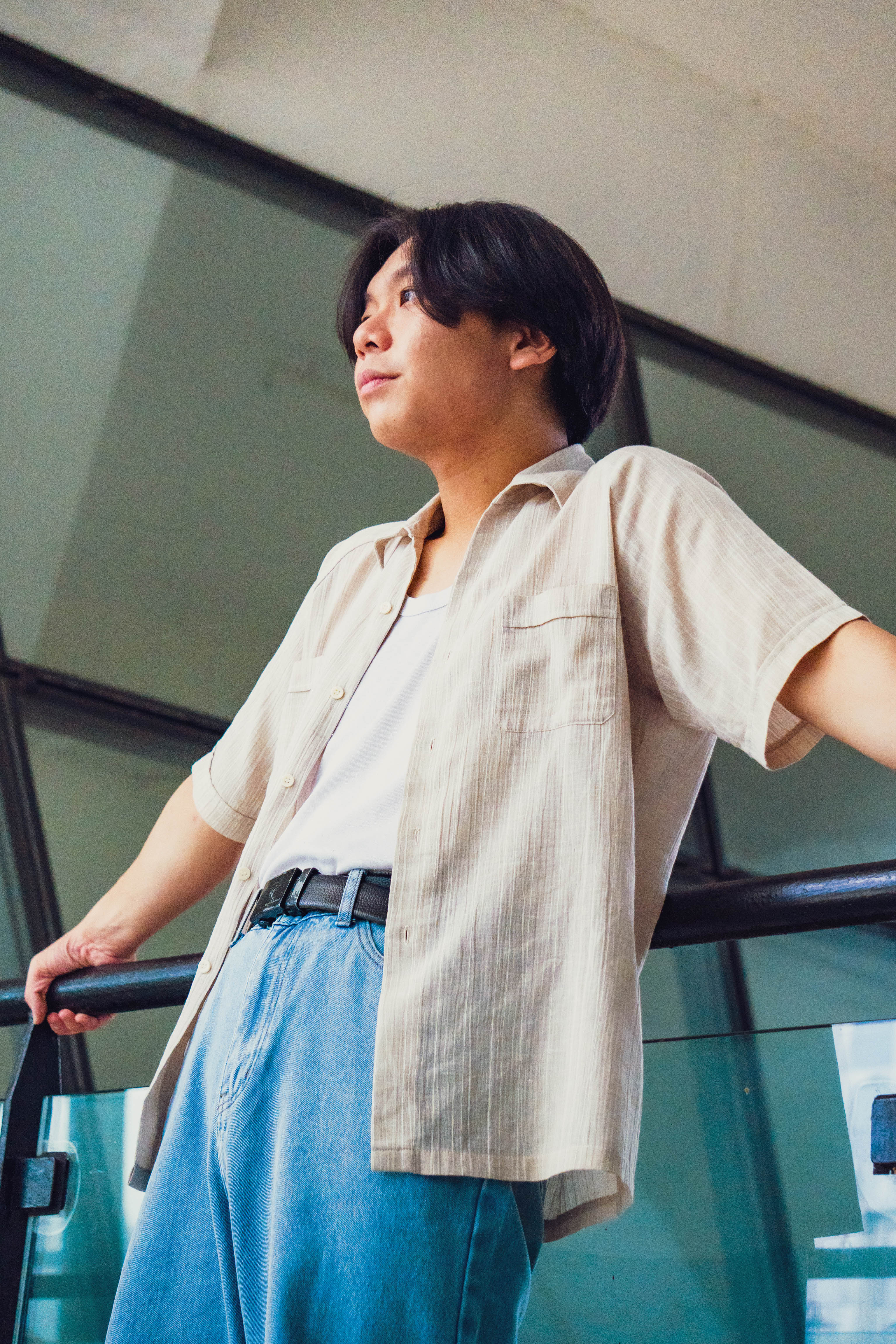 Relaxed shot of Ezekiel leaning against a railing