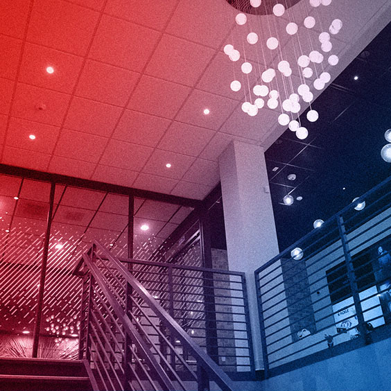 WTADS office entry way with pendant lights chandelier with red blue gradient overlay.