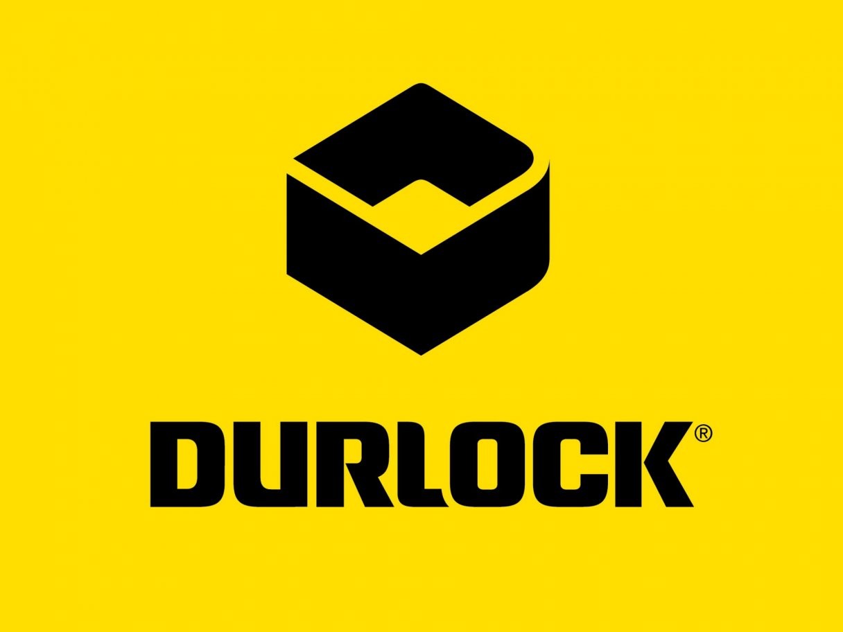 Rustic cabin in a golden field at sunset