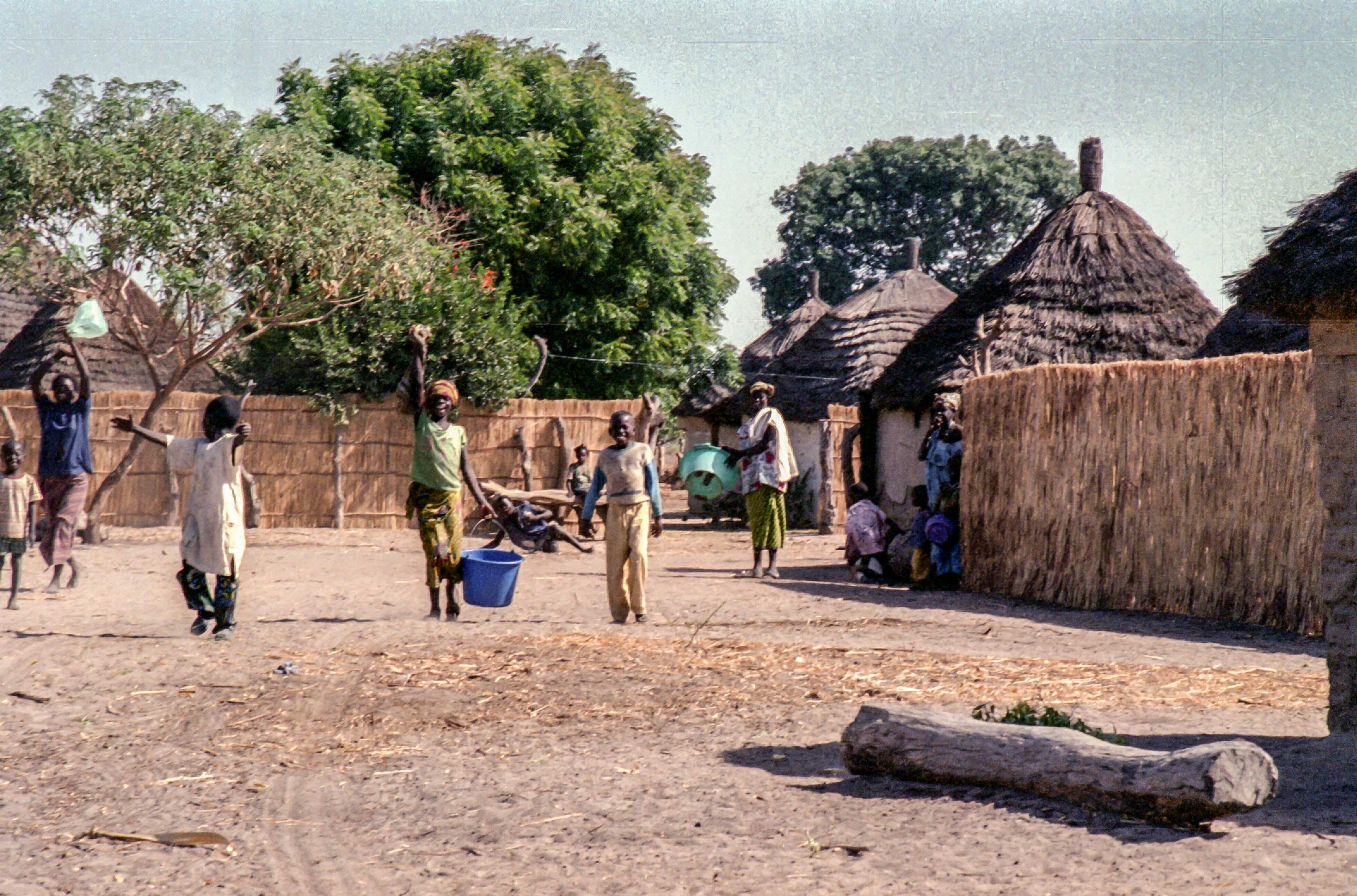 People are working in a small african village.
