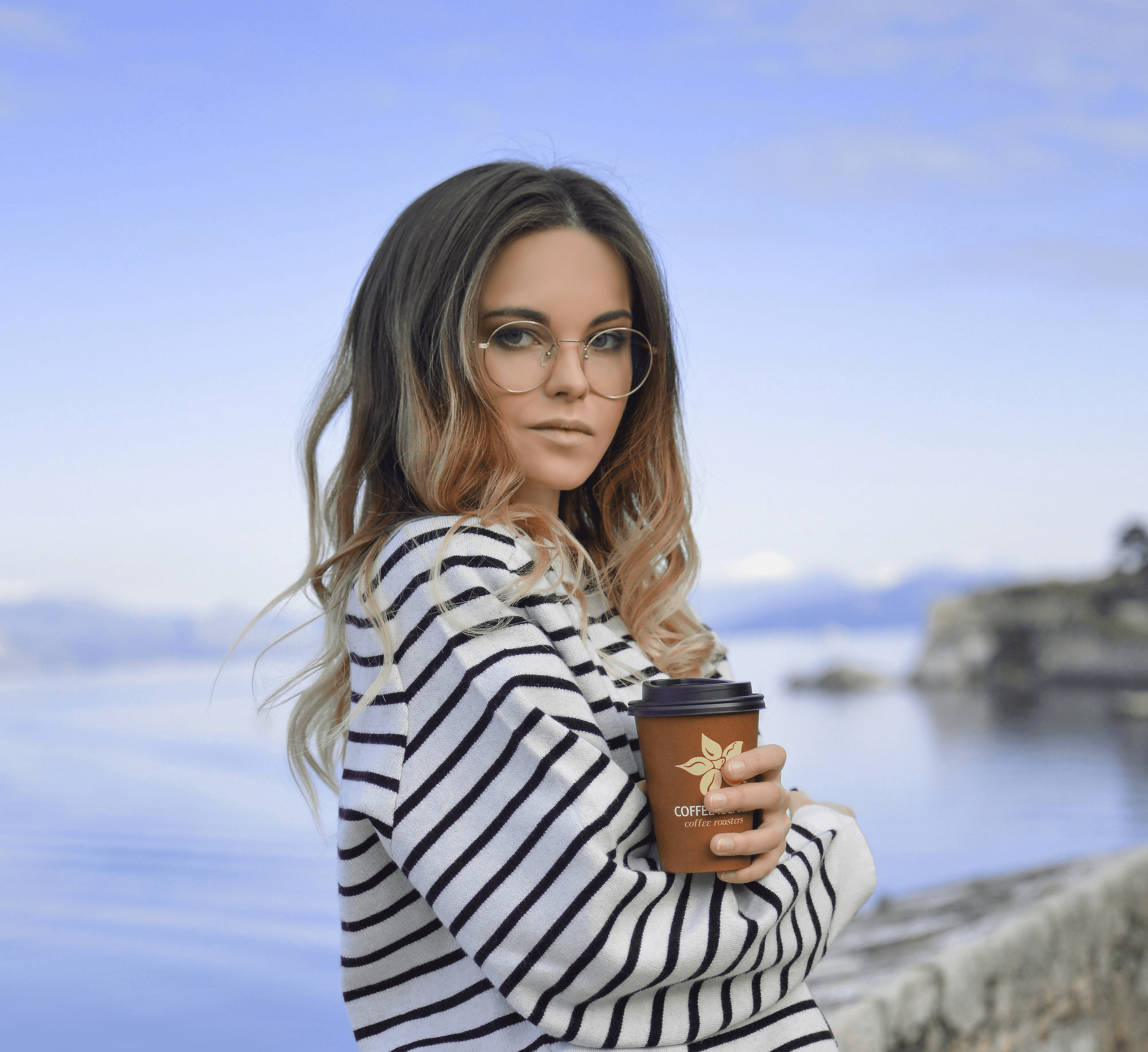 woman in white near calm body of water