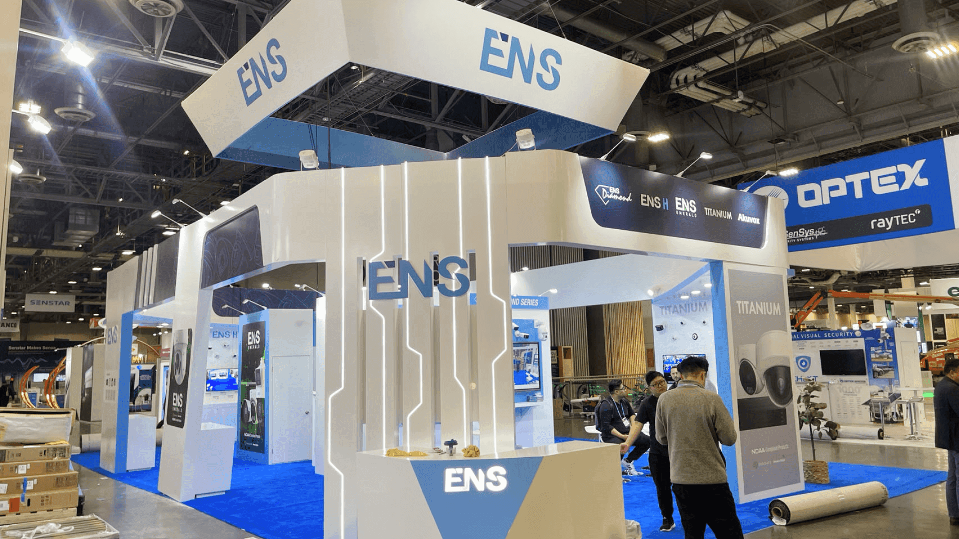 Conferencing and collaboration booth at Las Vegas Convention Center set with monitor array and conversation-led meeting area