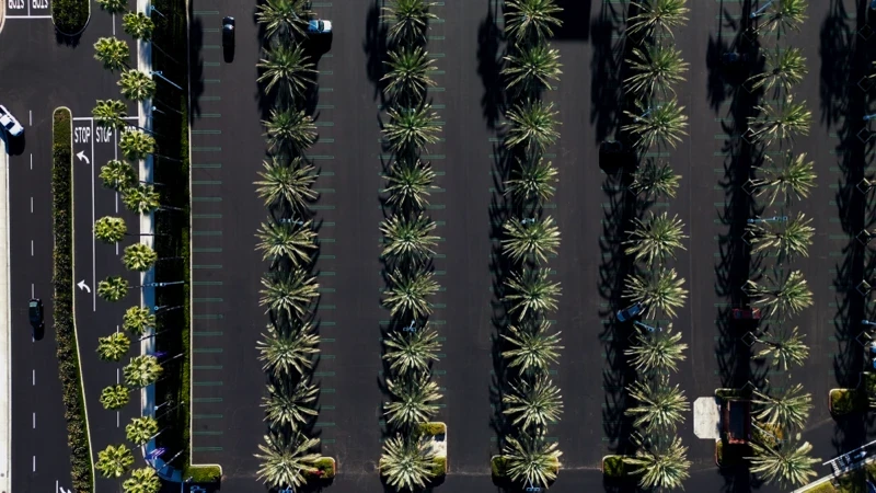Aerial photo of freshly seal coated and striped shopping mall parking lot