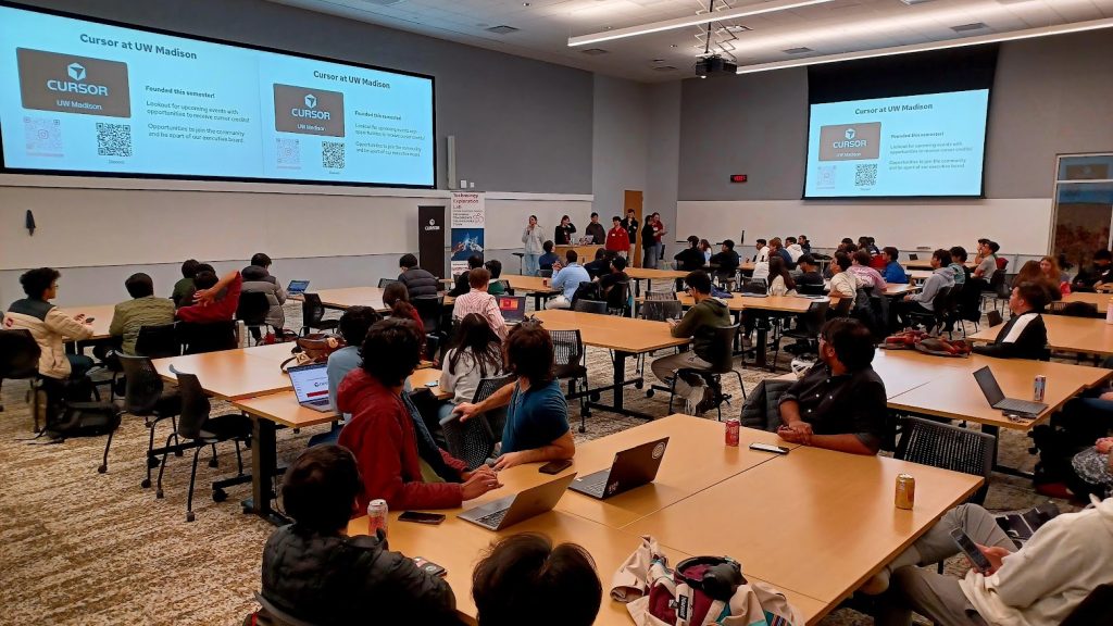 Participants Watching Presentation at Badger Build Fest 2025