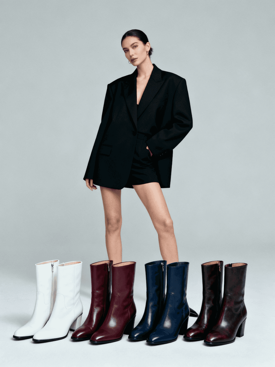 Woman portrait with pairs of shoe