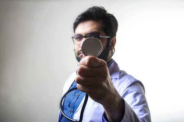 forensic doctor with magnifier