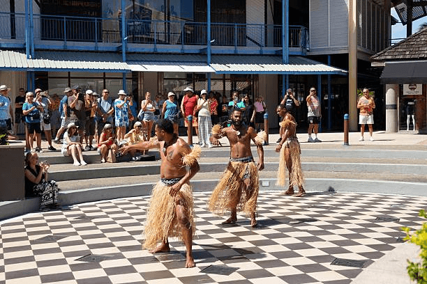 Maori cultural performance featuring haka dancers in traditional dress