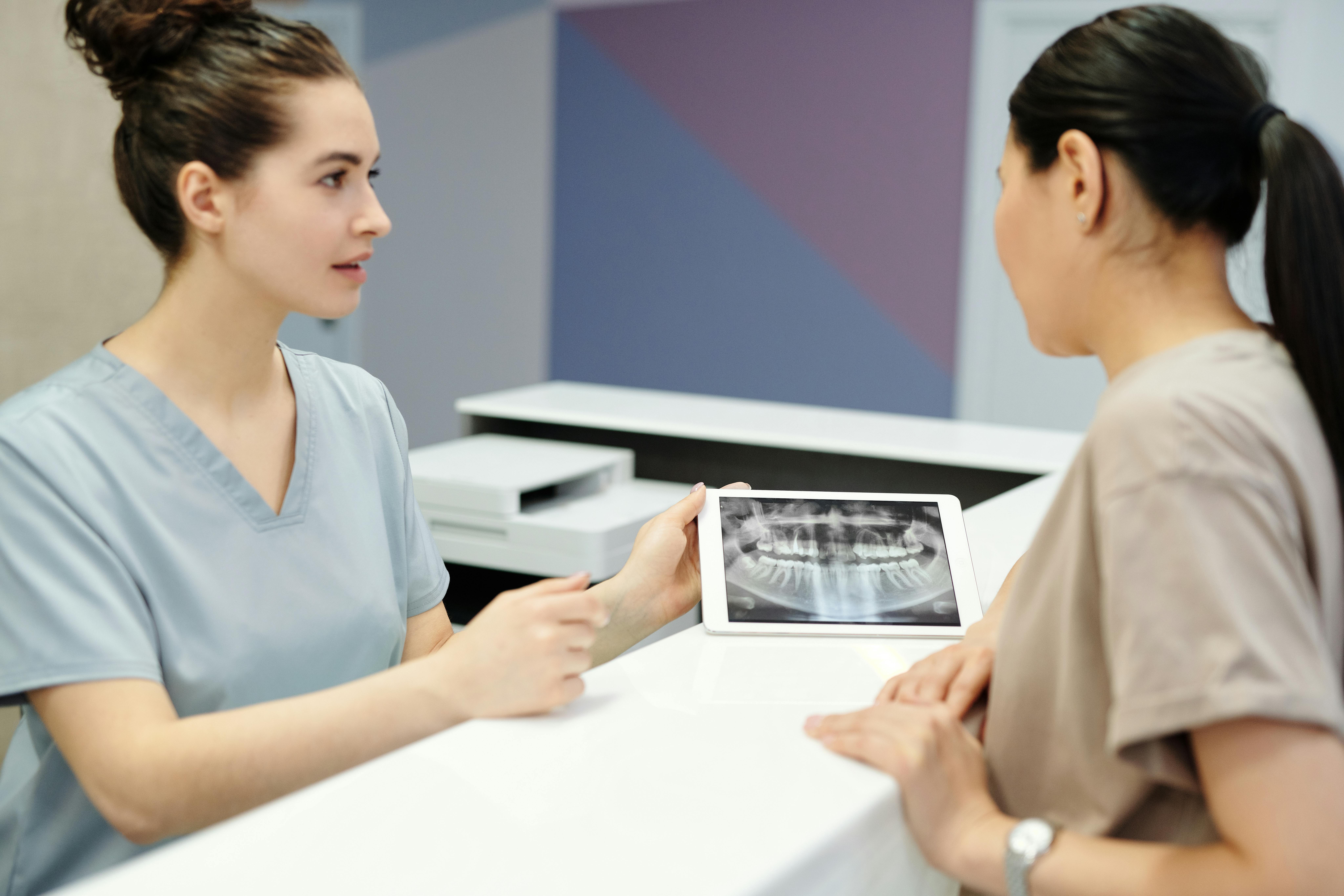 Picture showing two doctors dicussing a dental x ray