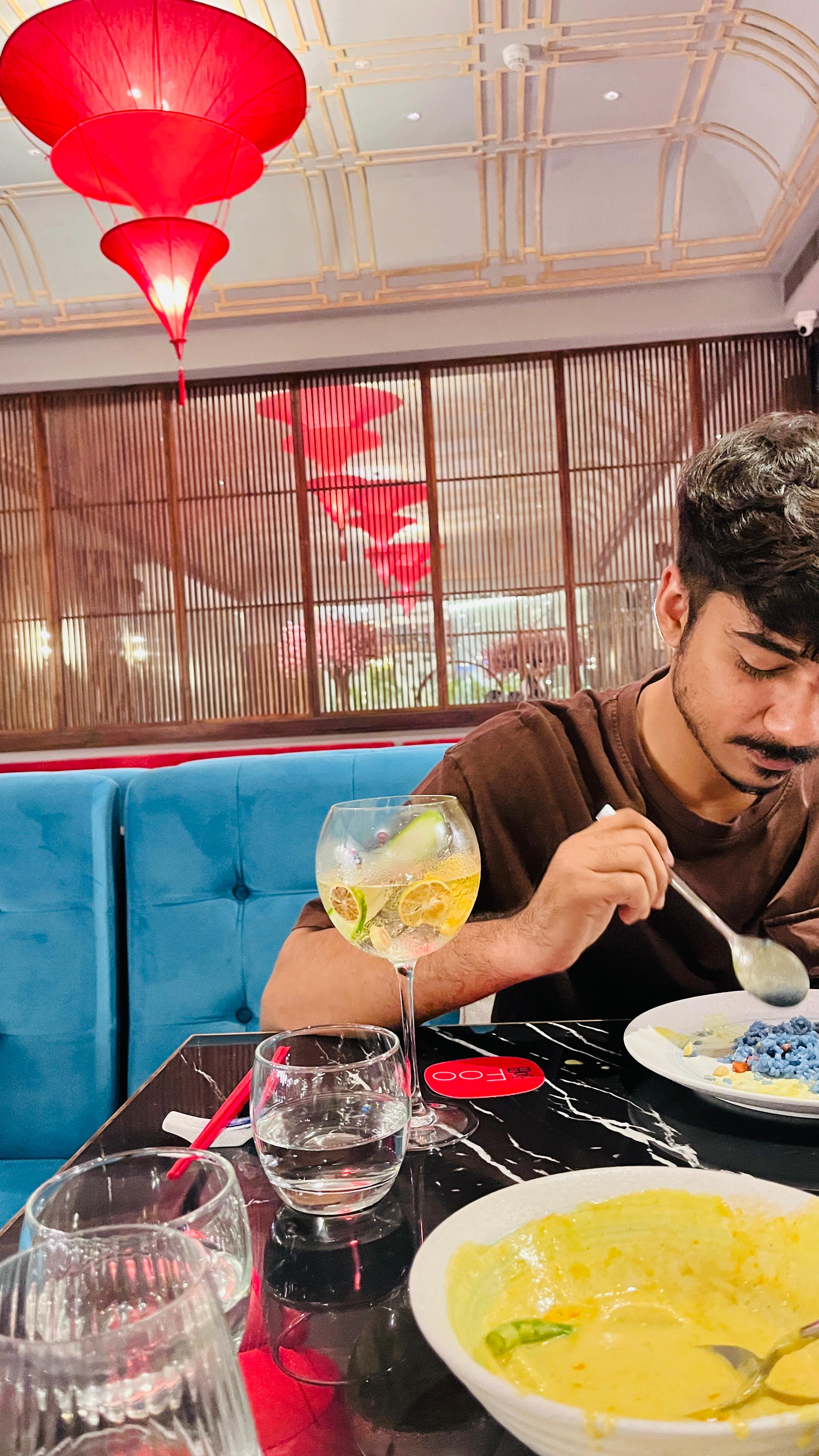 a group of people standing on top of a sandy beach