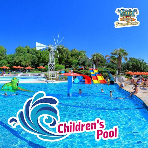 Children's pool with slides and water features; kids playing; trees and umbrellas in the background. Sign reads "Children's Pool."
