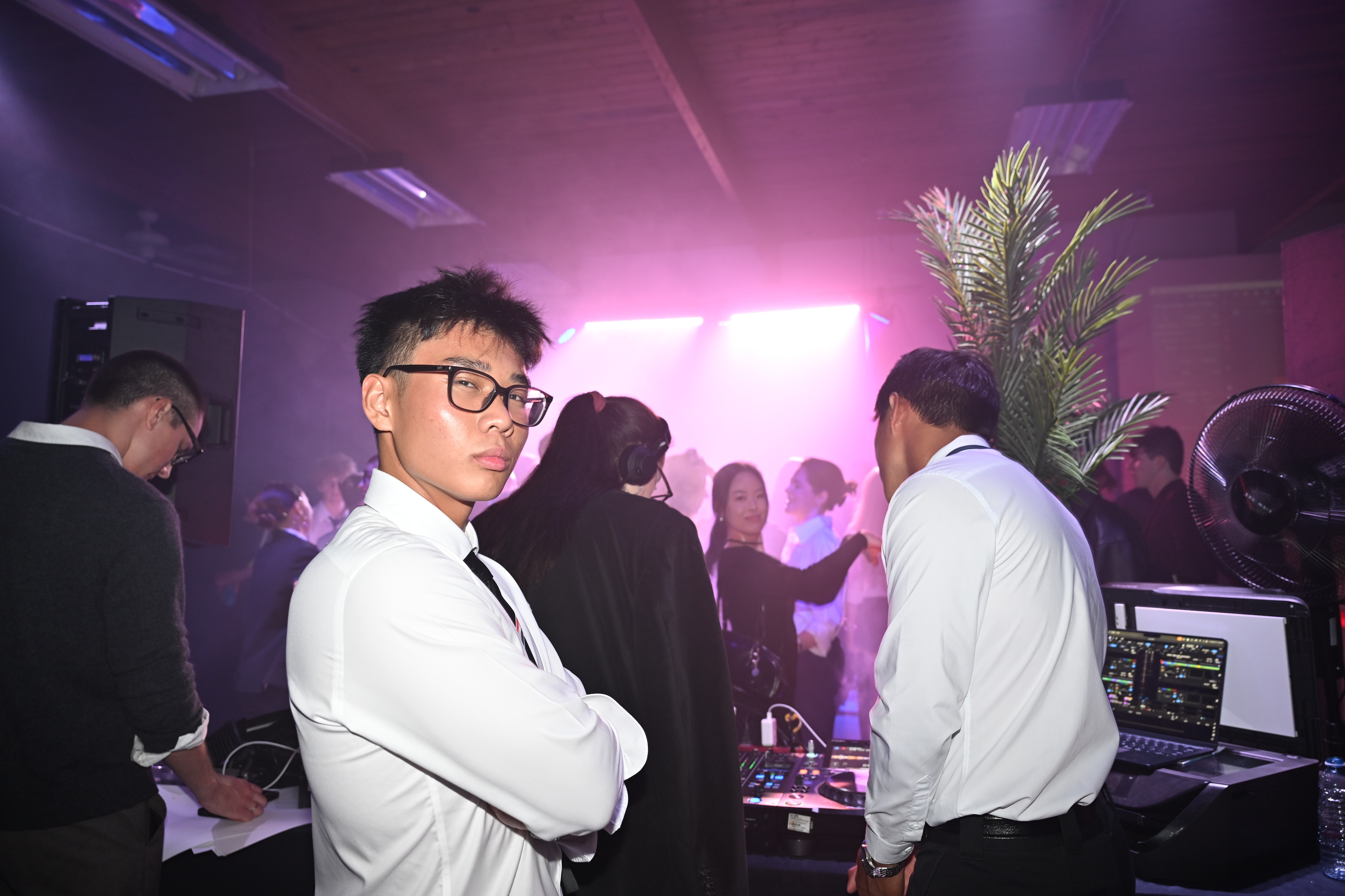 a woman holding a red flower