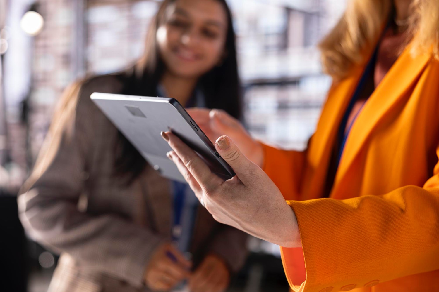 Professional using an intuitive software dashboard on a touchscreen display.