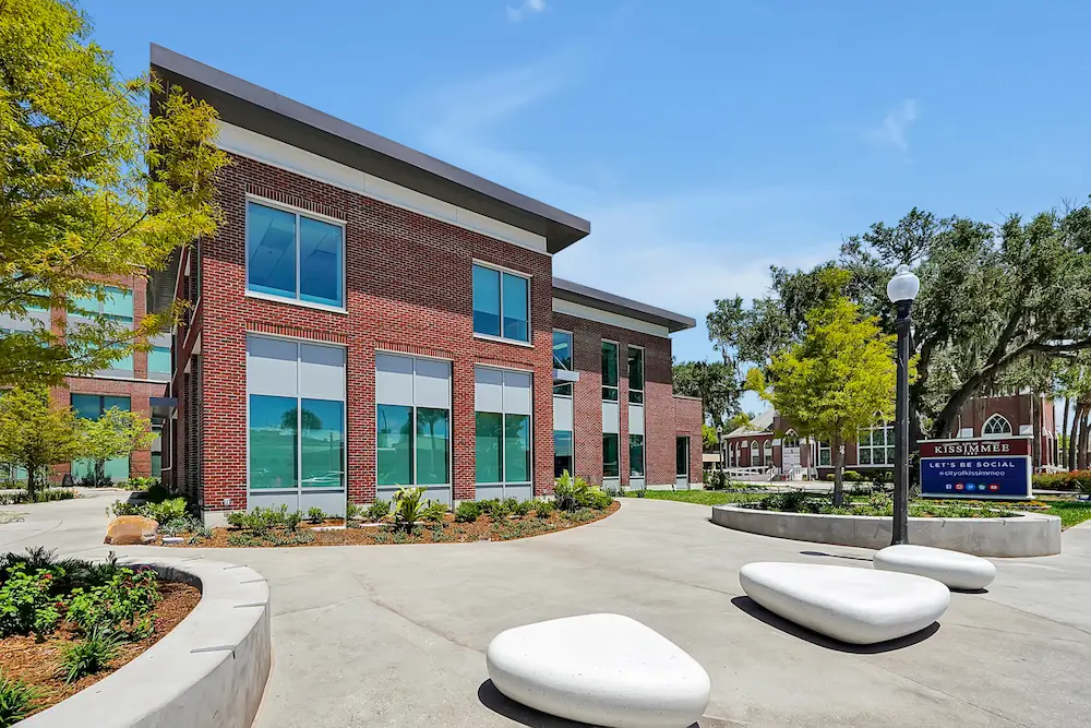  A multi-story building featuring multiple balconies on its exterior, showcasing a modern architectural design.