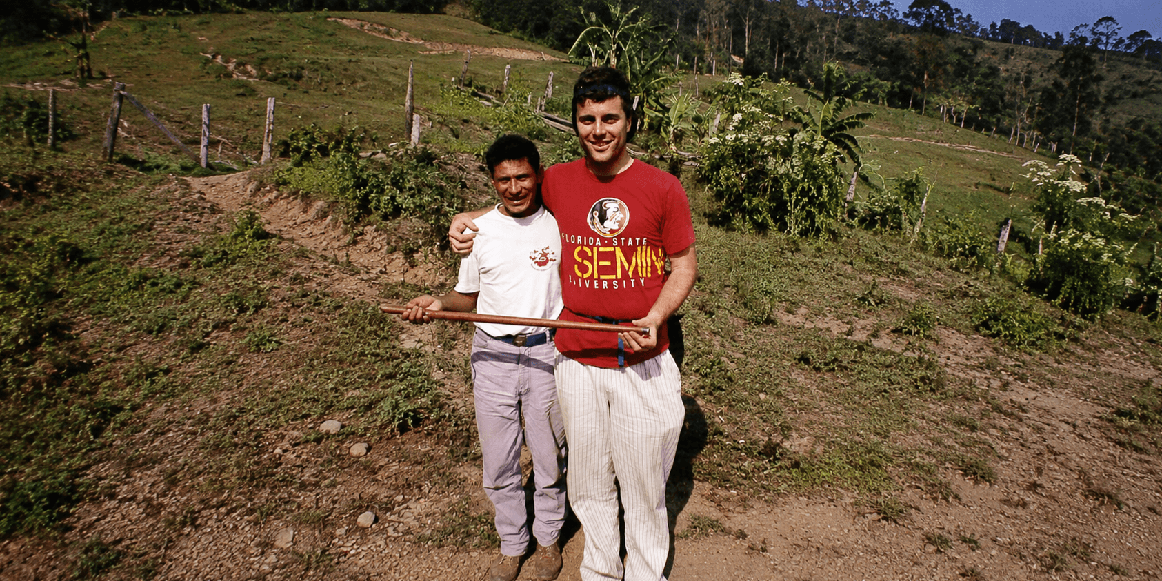 Rob MacKay stands with a Garifuna community member in rural Honduras during his Peace Corps service.