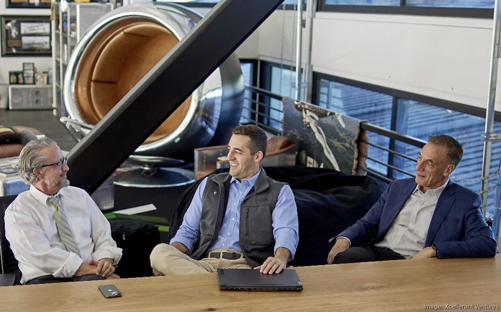 a black and white living room with a large tv