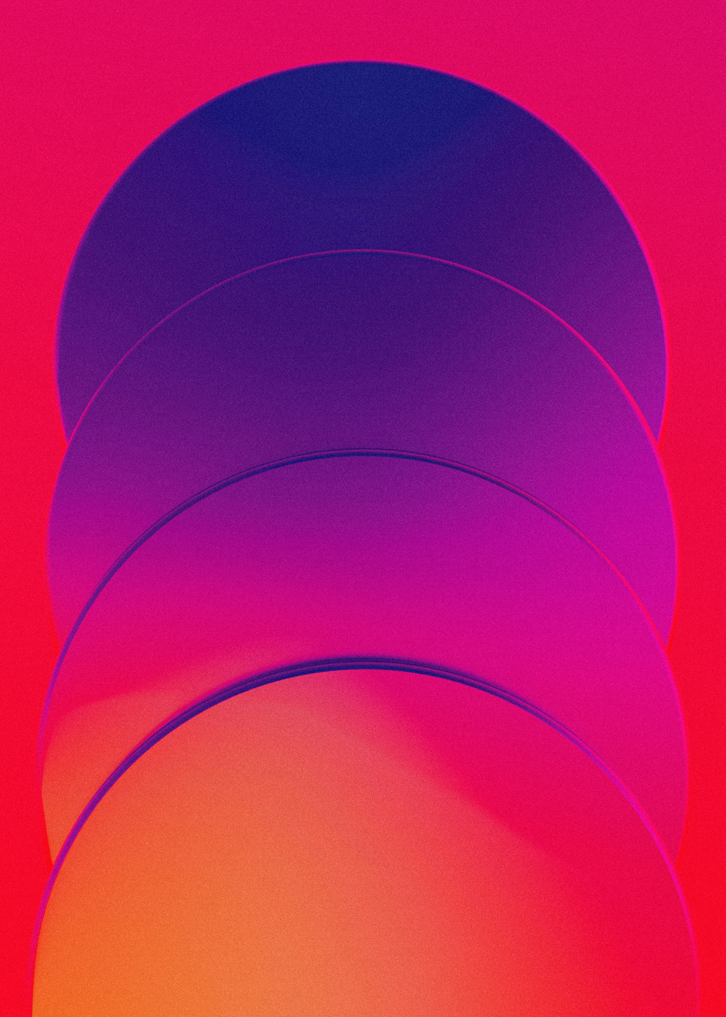 A stack of round discs on a red and pink background