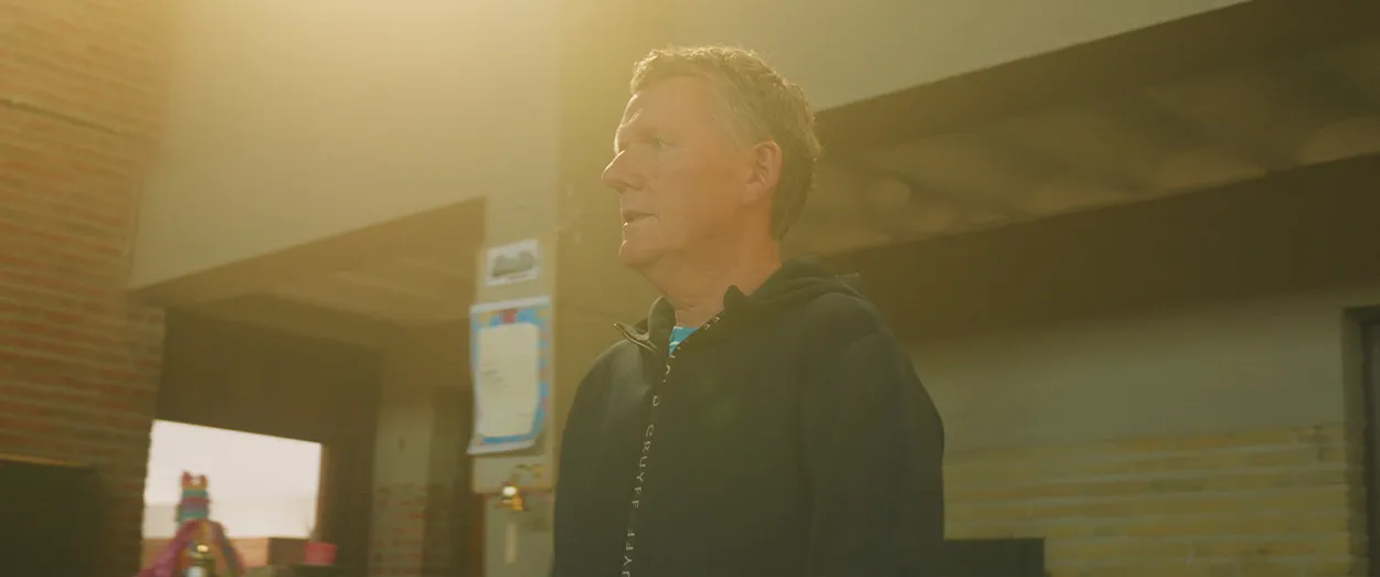 Man walking in church with big flare from the sun
