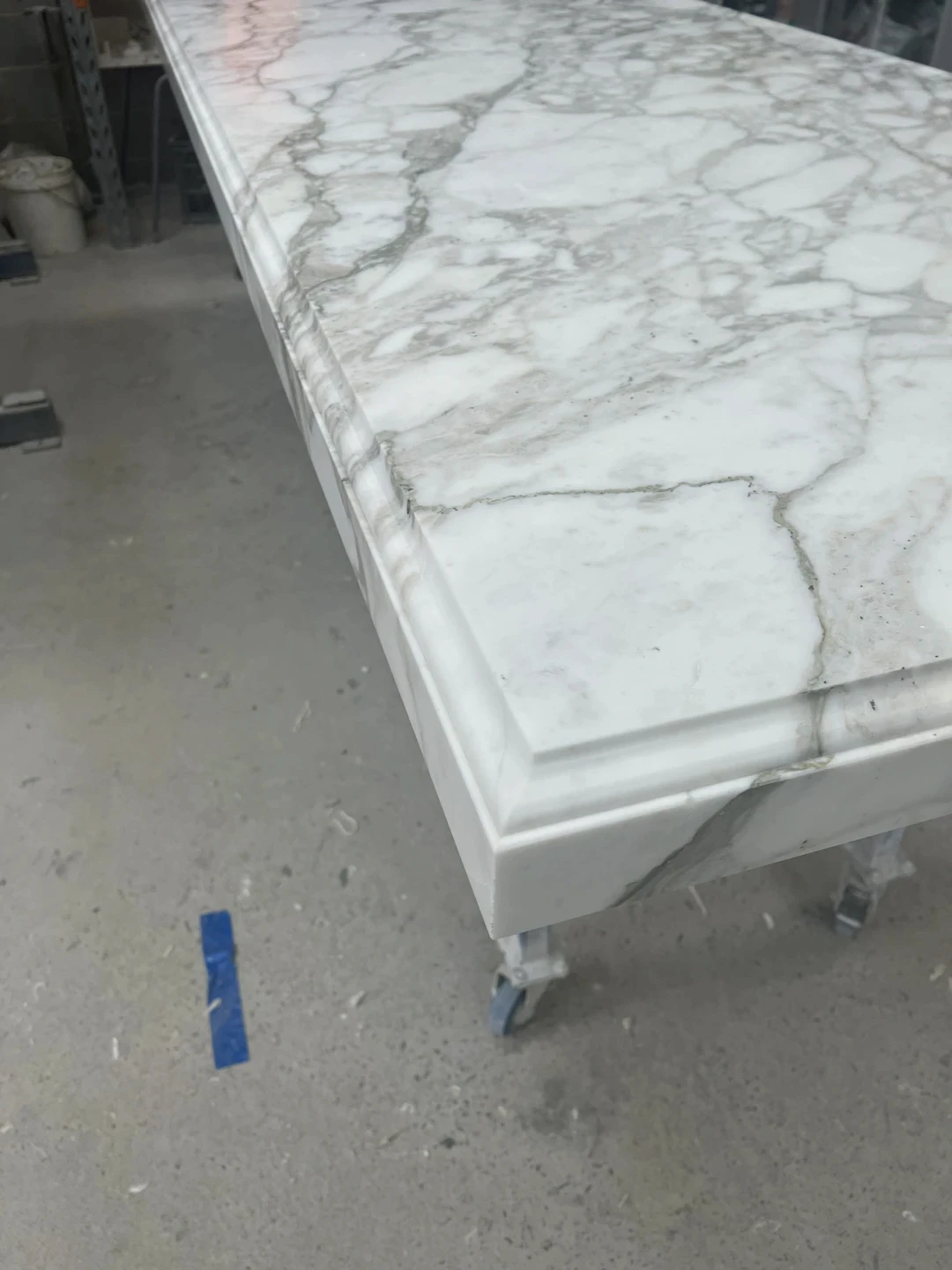 Natural stone shower or bathroom niche detail with marble slab edge and clean installation finish.