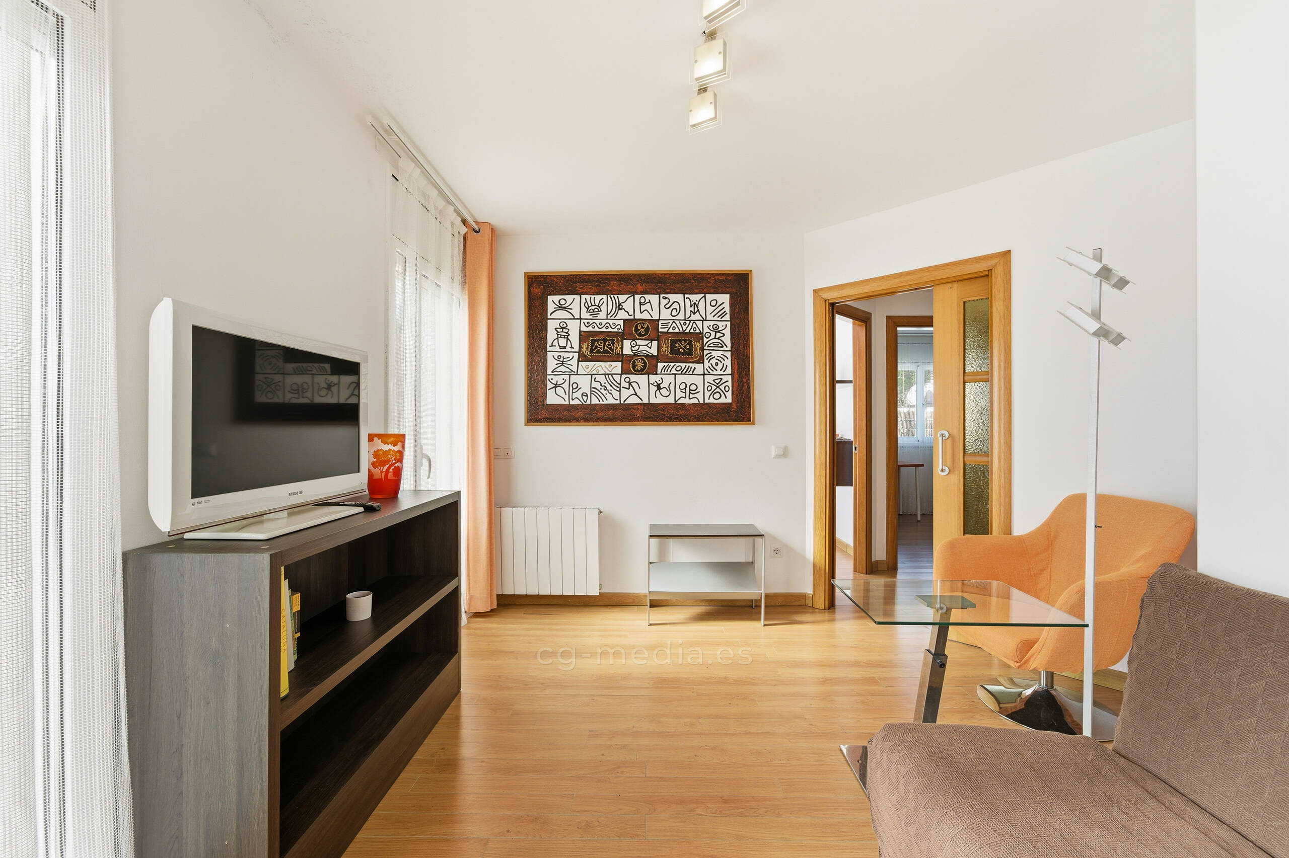 A woman standing in front of a colorful wall
