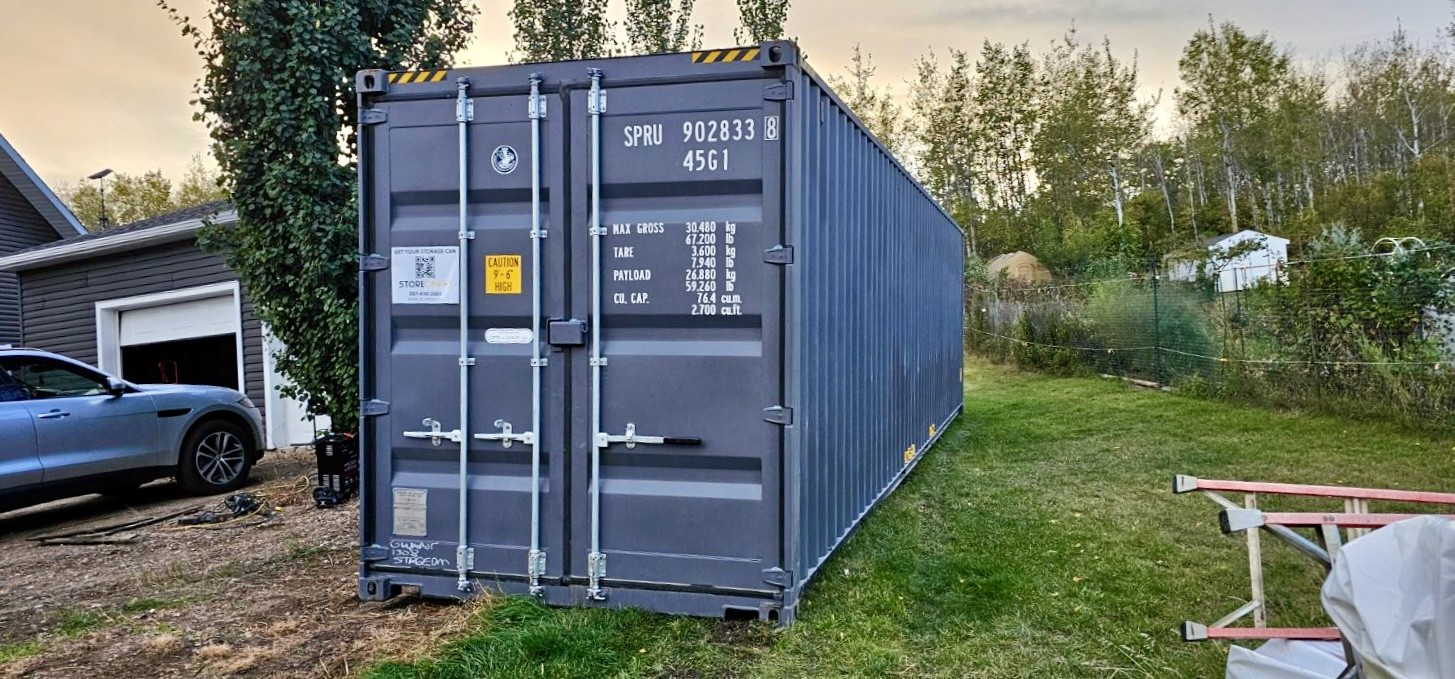 40' High Cube New Charcoal Grey container delivered in residential area