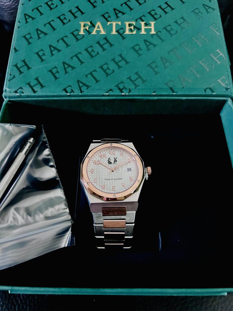round silver-colored Rolex analog watch with link band