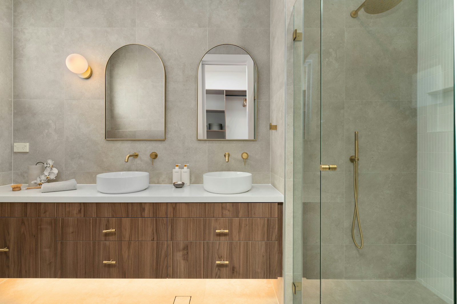 Modern bathroom with double vanity and shower