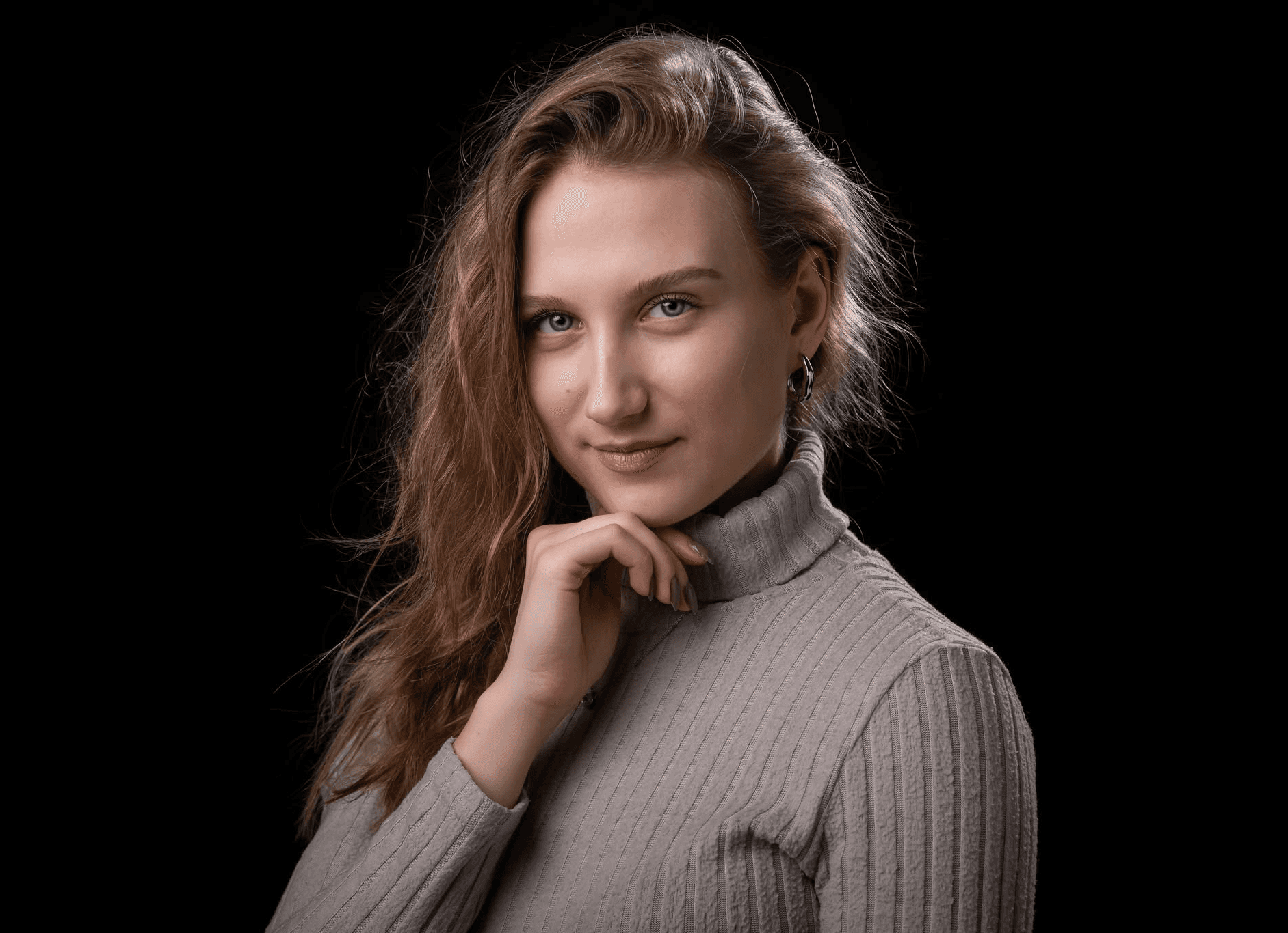 woman in white coat smiling