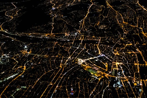 Drone shot of a running track at night