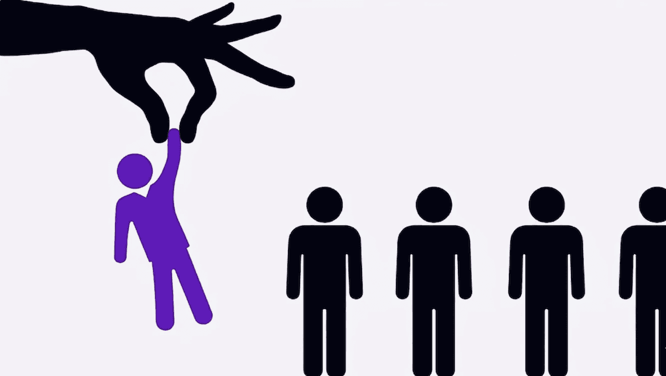 A hand picking up someone among others