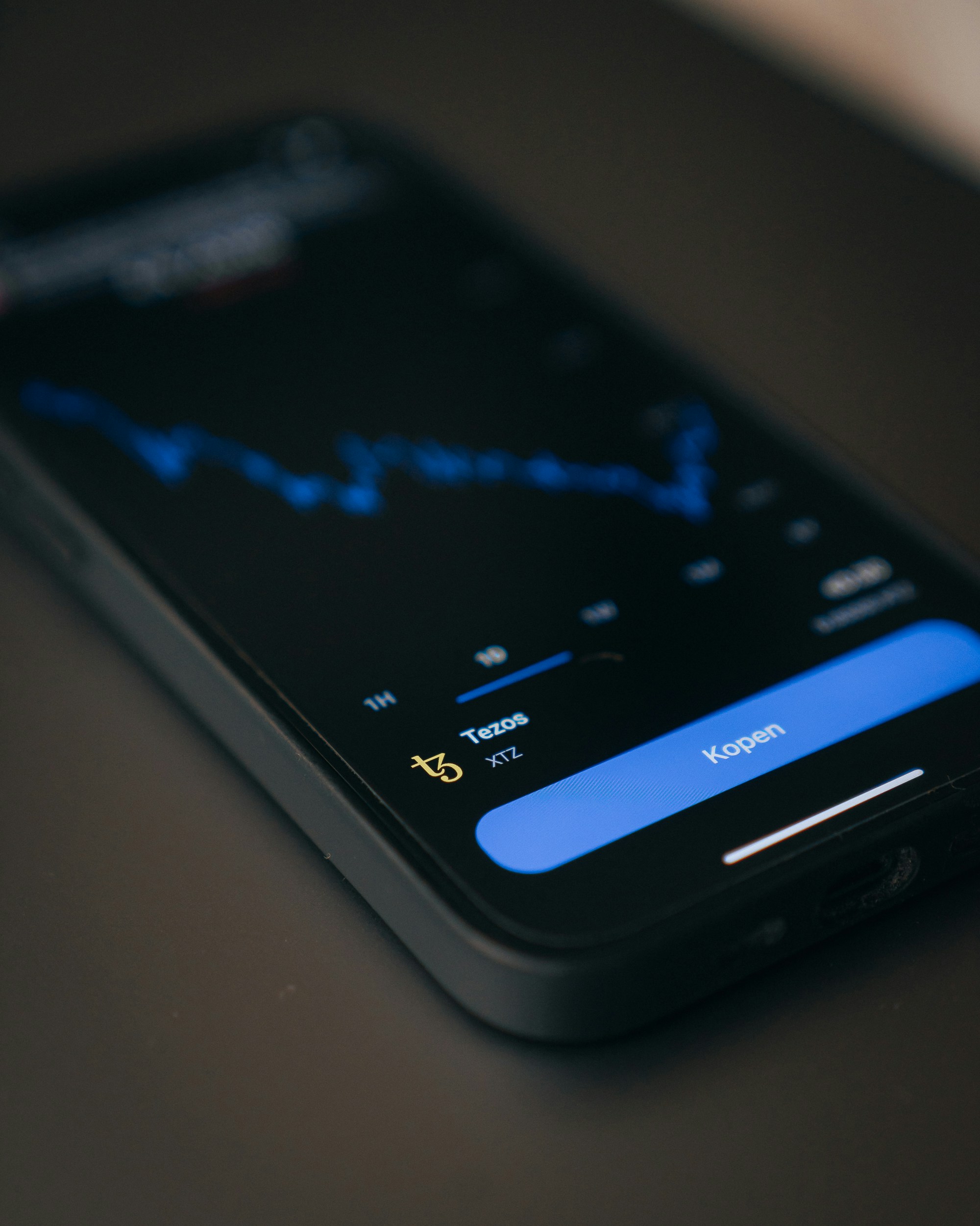 a close up of a cell phone on a table