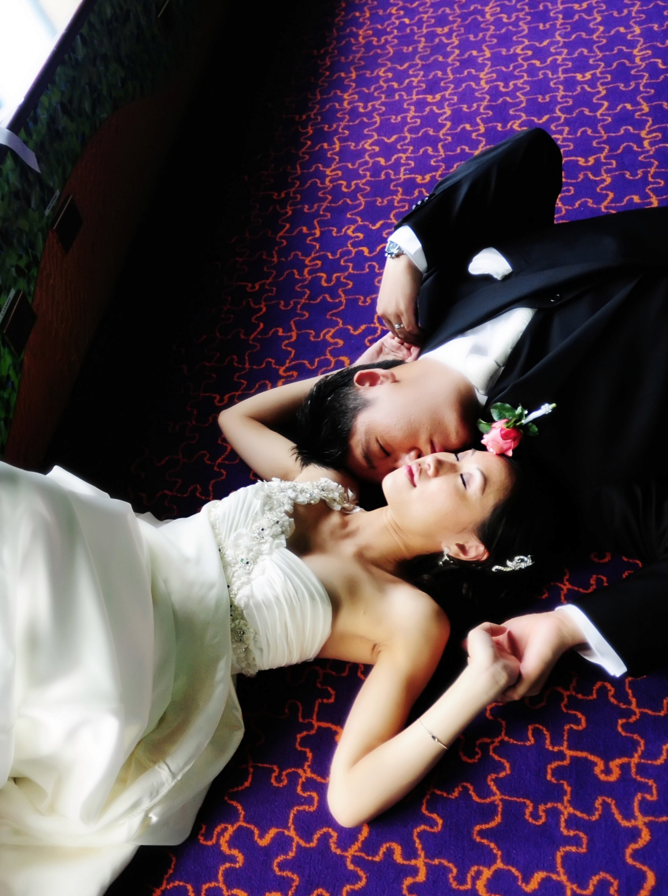 Asian bride and groom lying together — wedding photography Atlanta GA