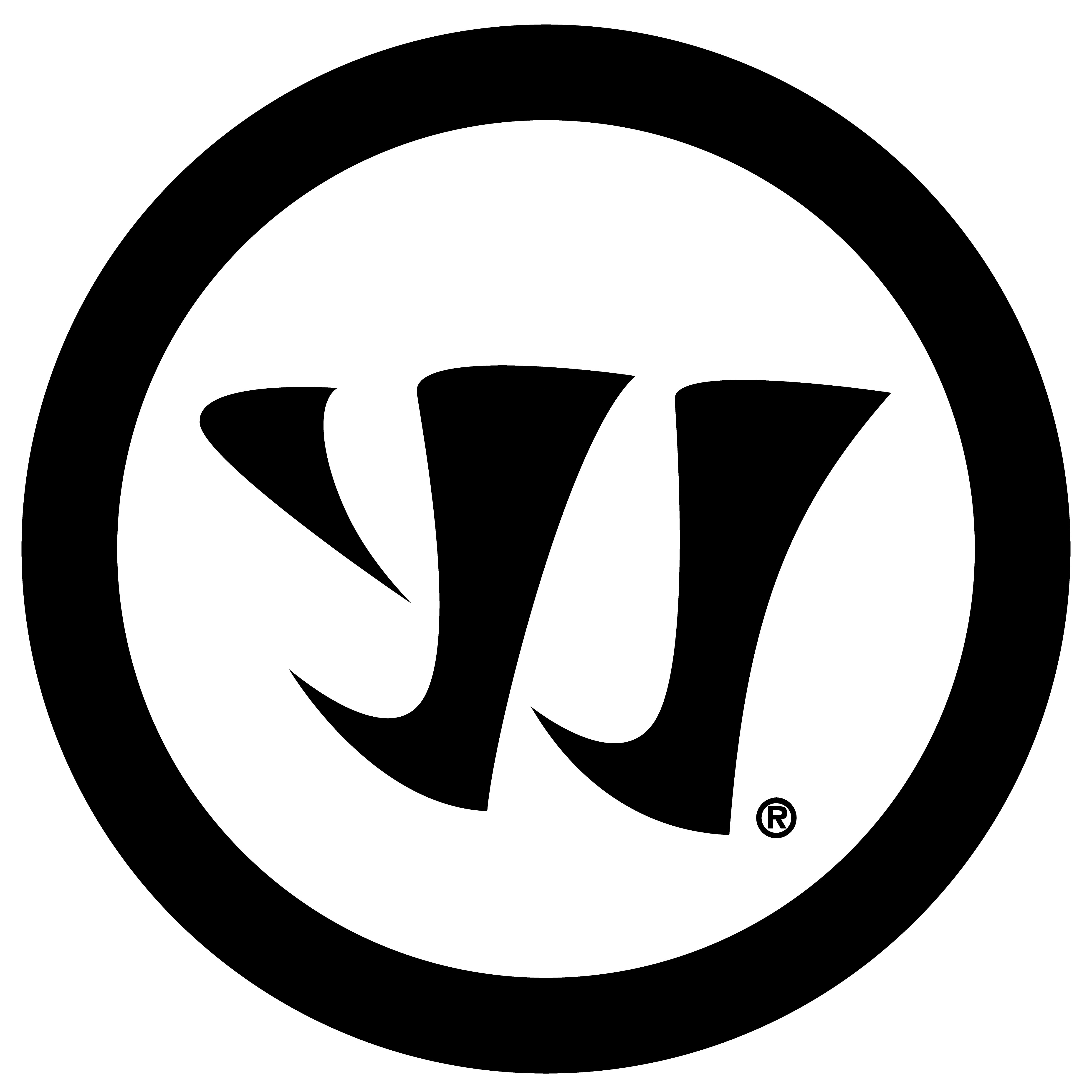 Young person with wavy hair poses confidently in sunlight against a modern building backdrop. Wears a black blazer and silver necklace, conveying elegance.