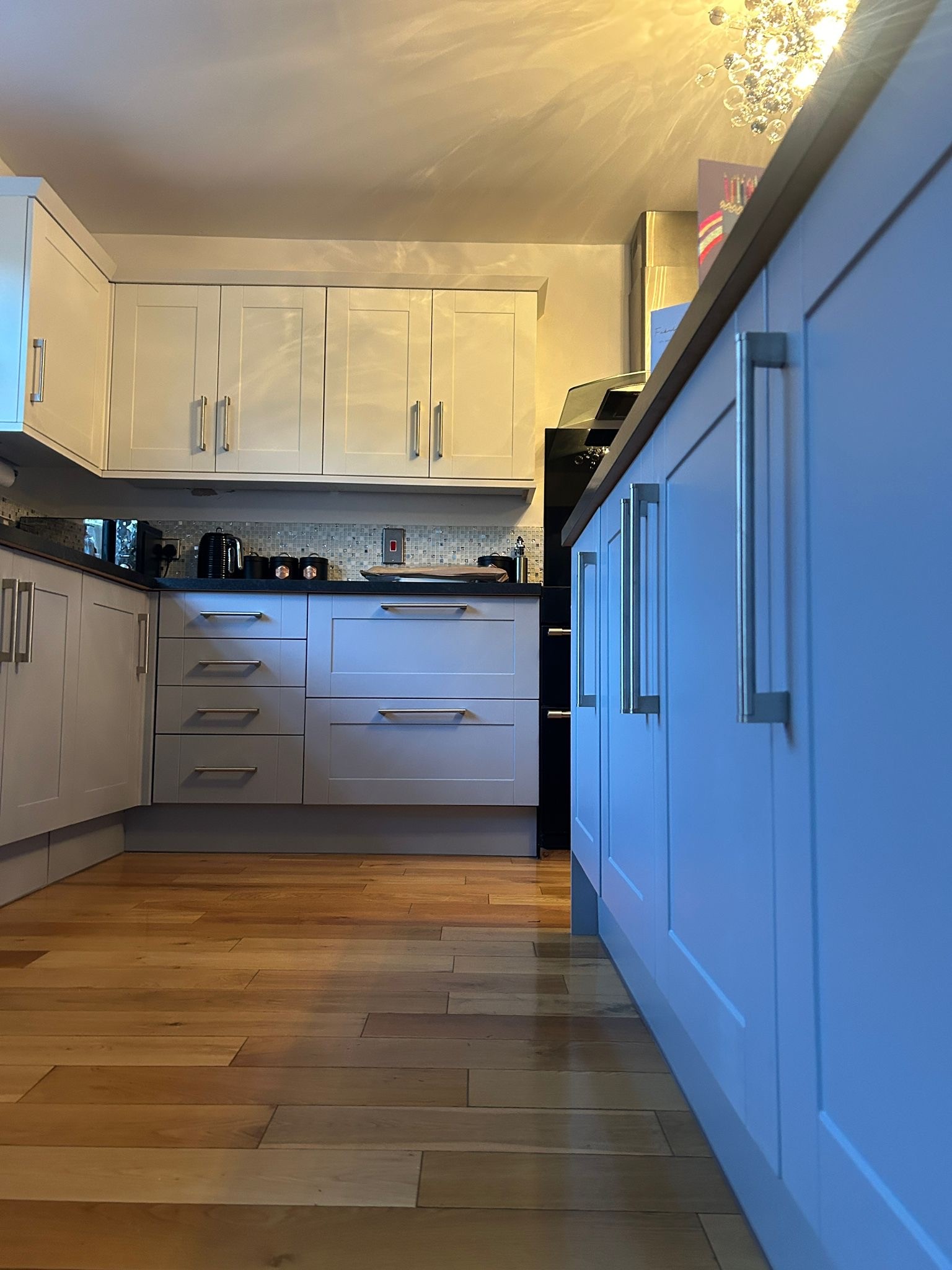 white and grey kitchen cabinets freshly sprayed