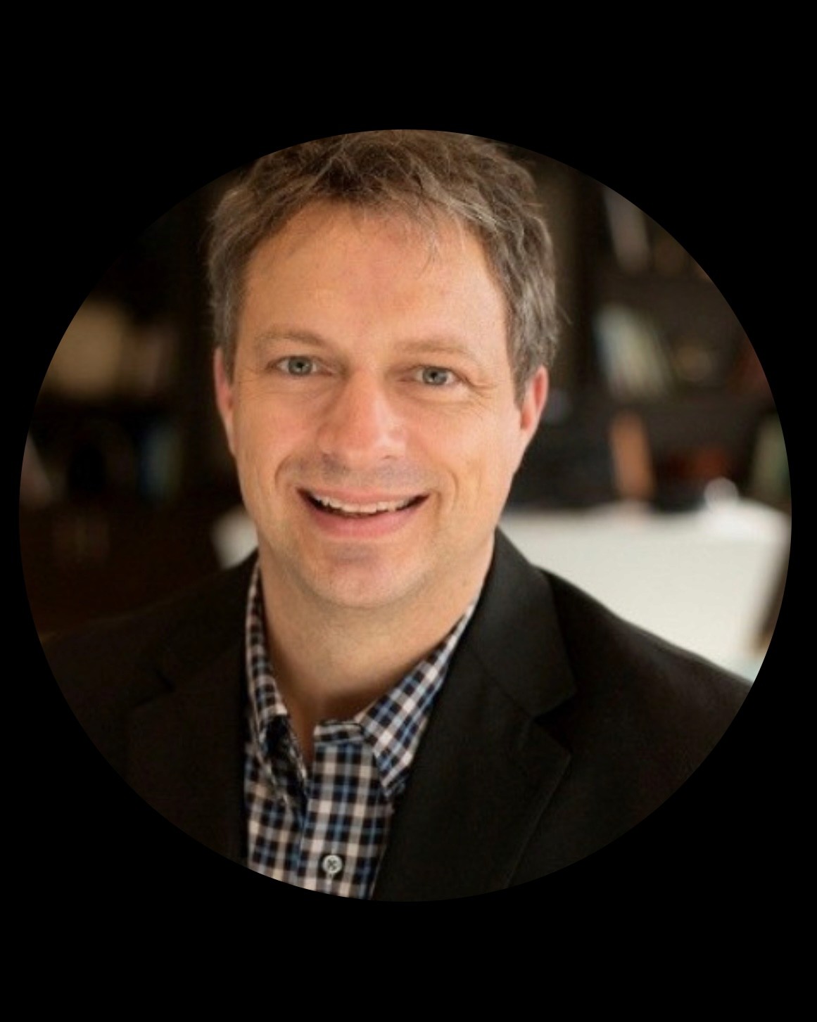 man standing behind flat screen computer monitor