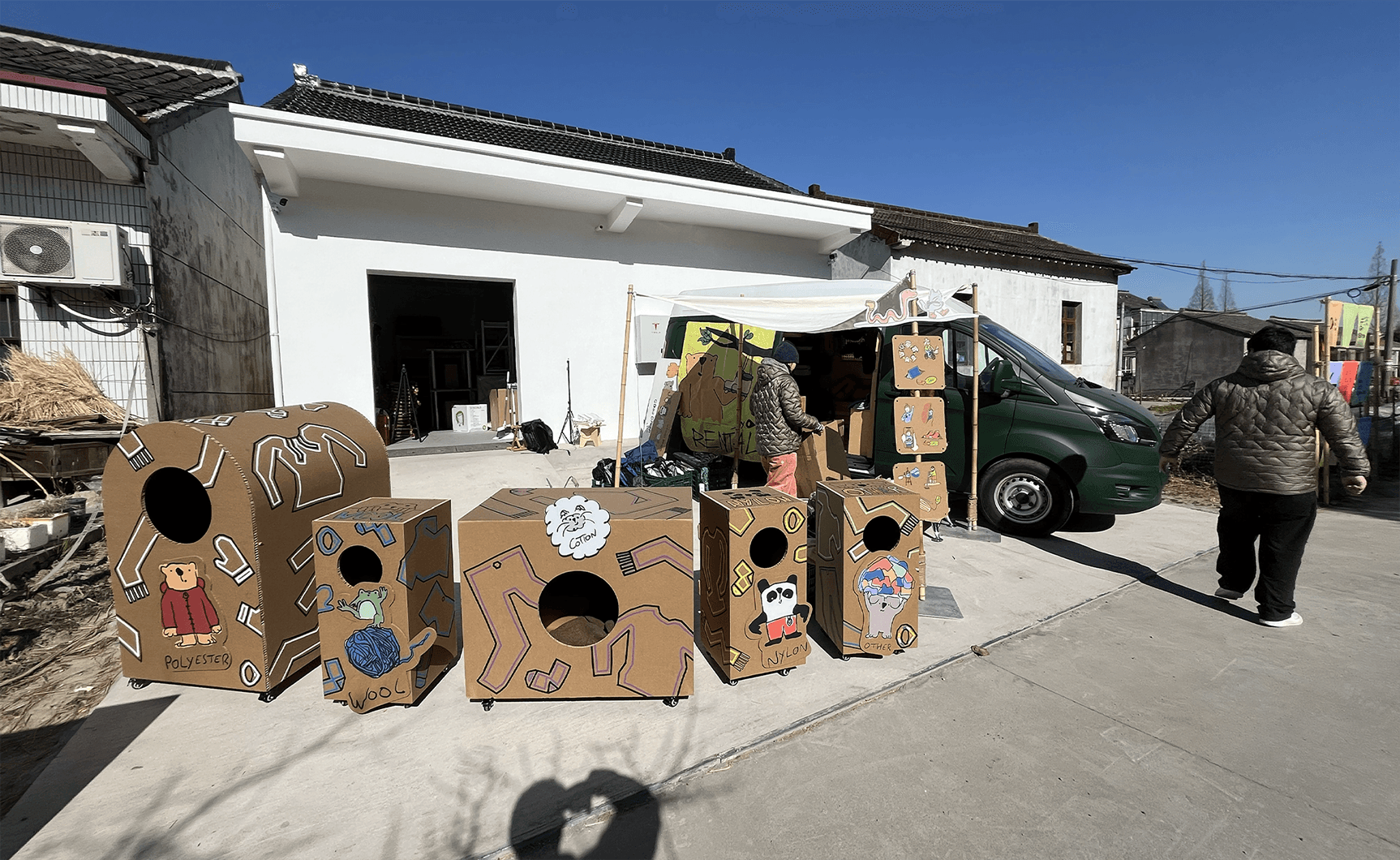Photo of Mathis Gauguelat's GOes Green cardboard recycling station pop-up display in a public setting.
