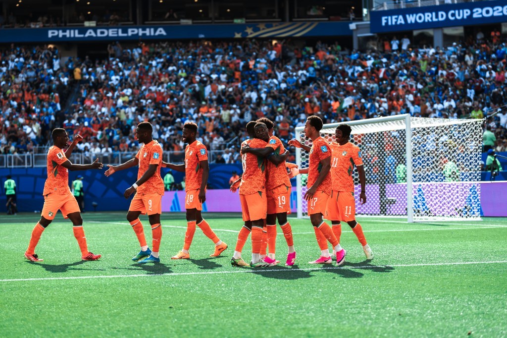 Ivory Coast players celebrate in a huddle after scoring against Curaçao at Philadelphia Stadium
